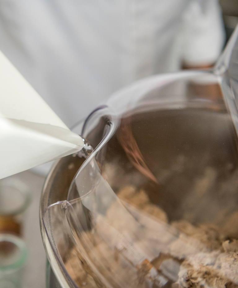Adding water through the safety cover hole while kneading
