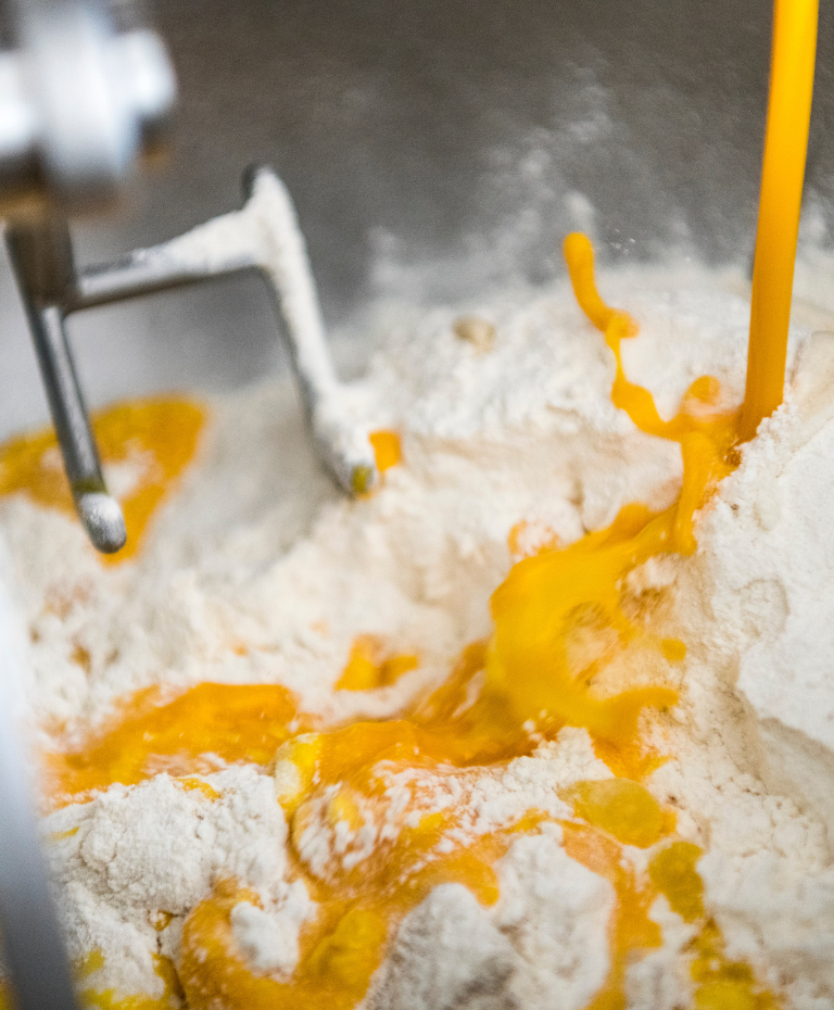 Egg added to flour for enriched dough